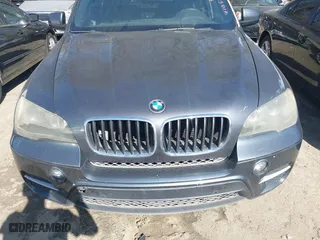 2011 BMW X5 35i with VIN 5UXZV4C58BL410570, listed as a IAAI auction lot 41886238 with 164,192 mi miles. Bid and sale history available at carsss.com. Image 6.