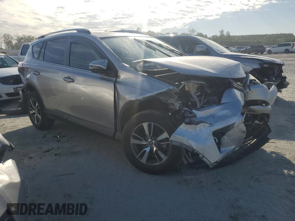2018 Toyota RAV4 XLE with VIN JTMWFREV0JJ191707, listed as a Copart auction lot 57821575 with Not provided miles and Salvage title. Bid and sale history available at DreamBid. Image 4.
