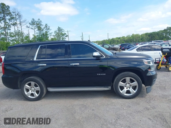 2015 Chevrolet Tahoe LT with VIN 1GNSCBKC1FR615817, listed as a IAAI auction lot 41760474 with 242,148 mi miles and . Bid and sale history available at DreamBid. Image 13.