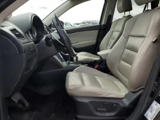 2014 Mazda CX-5 Grand Touring with VIN JM3KE4DY3E0304908, listed as a Copart auction lot 53873655 with 144,382 mi miles and Salvage Title. Bid and sale history available at DreamBid. Image 7.