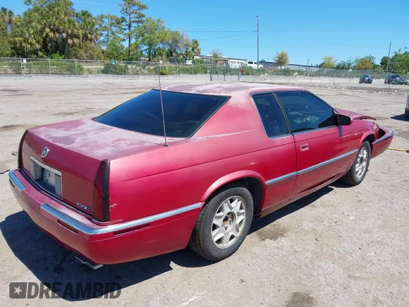 2002 Cadillac Eldorado ESC z VIN 1G6EL12Y72B102153, wystawiony jako IAAI lot #41861541 z przebiegiem 91 273 mil mil oraz . Historia ofert i sprzedaży dostępna na DreamBid. Obrazek 4.