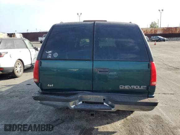 1997 Chevrolet Suburban with VIN 3GNFK16R4VG163602, listed as a Copart auction lot 76081984 with 243,169 mi miles and Salvage Title. Bid and sale history available at carsss.com. Image 6.