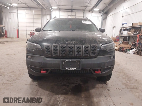 2020 Jeep Cherokee Trailhawk z VIN 1C4PJMBX4LD507364, wystawiony jako IAAI lot #41202333 z przebiegiem 90 000 mil mil oraz . Historia ofert i sprzedaży dostępna na DreamBid. Obrazek 12.