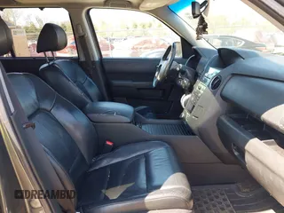 2011 Honda Pilot Touring with VIN 5FNYF4H94BB035415, listed as a IAAI auction lot 42126738 with 239,273 mi miles. Bid and sale history available at carsss.com. Image 5.