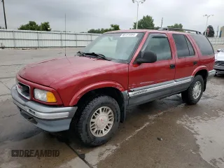 1997 GMC Jimmy SLS with VIN 1GKDT13W8V2515536, listed as a Copart auction lot 66701094 with 123,051 mi miles and Salvage Title. Bid and sale history available at carsss.com. Image 1.