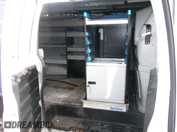2015 Chevrolet Express Cargo Van with VIN 1GCWGFCF3F1159655, listed as a IAAI auction lot 42138892 with 174,633 mi miles. Bid and sale history available at carsss.com. Image 1.