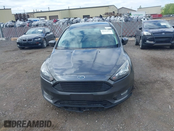 2018 Ford Focus SE z VIN 1FADP3FE5JL228583, wystawiony jako IAAI lot #42313614 z przebiegiem 84 240 mil mil oraz . Historia ofert i sprzedaży dostępna na DreamBid. Obrazek 12.