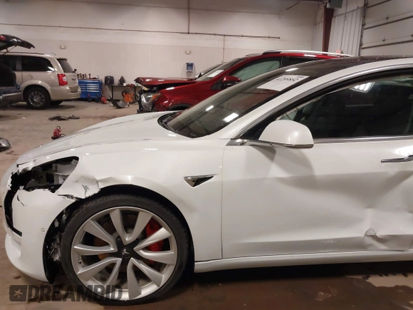 2018 Tesla Model 3 Long Range Battery with VIN 5YJ3E1EB5JF084446, listed as a IAAI auction lot 41209852 with 70,125 mi miles and . Bid and sale history available at DreamBid. Image 20.