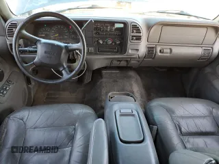 1999 GMC Yukon with VIN 1GKEK13R3XJ750307, listed as a Copart auction lot 84728104 with 212,879 mi miles and Salvage Title. Bid and sale history available at carsss.com. Image 8.