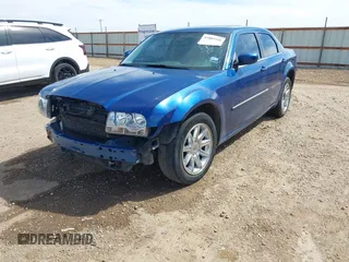 2009 Chrysler 300 Touring with VIN 2C3LA53V89H512049, listed as a IAAI auction lot 41883948 with 167,923 mi miles. Bid and sale history available at carsss.com. Image 2.