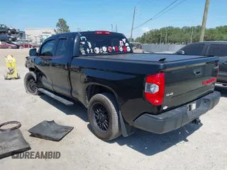 2019 Toyota Tundra SR with VIN 5TFUY5F13KX852912, listed as a IAAI auction lot 42327399 with 124,193 mi miles and . Bid and sale history available at DreamBid. Image 3.