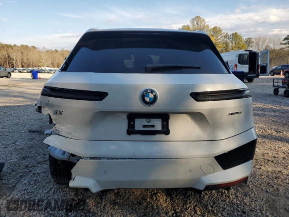 2025 BMW iX xDrive50 with VIN WB523CF0XSCS62033, listed as a Copart auction lot 42503325 with 7,294 mi miles and Salvage Title. Bid and sale history available at carsss.com. Image 6.