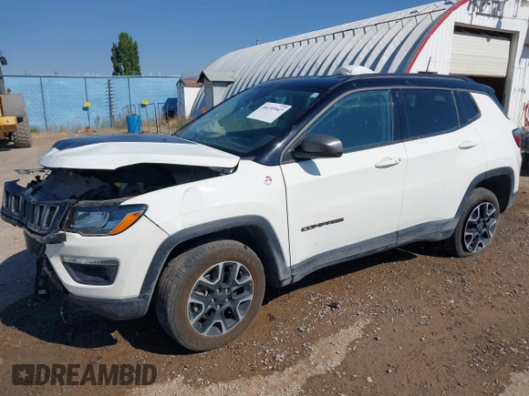 2021 Jeep Compass Trailhawk with VIN 3C4NJDDB0MT551172, listed as a IAAI auction lot 40155947 with 50,794 mi miles and . Bid and sale history available at DreamBid. Image 2.