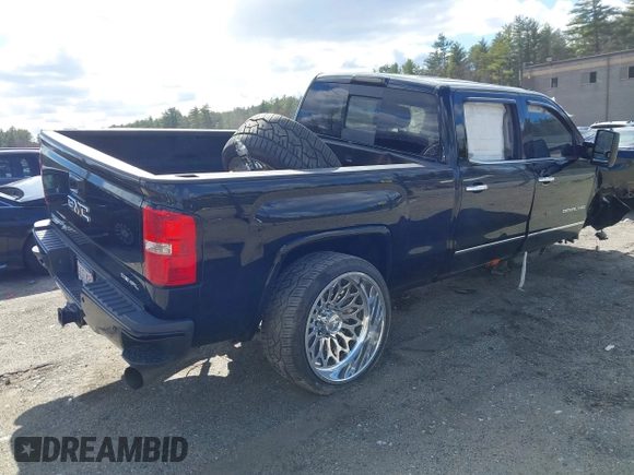 2019 GMC Sierra 2500HD Denali z VIN 1GT12SEY3KF232018, wystawiony jako IAAI lot #41897434 z przebiegiem Nie podano mil oraz . Historia ofert i sprzedaży dostępna na DreamBid. Obrazek 4.