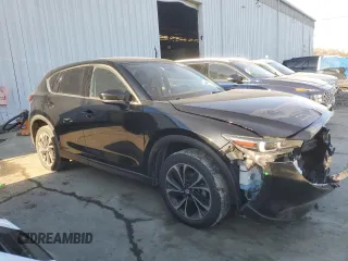 2022 Mazda CX-5 2.5 S Premium Package with VIN JM3KFBDM8N1544836, listed as a Copart auction lot 45573495 with 75,312 mi miles and Salvage Title. Bid and sale history available at carsss.com. Image 4.