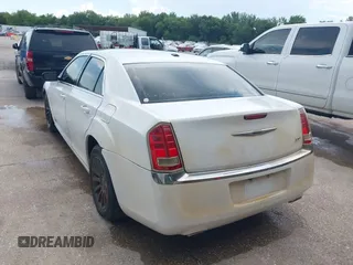 2013 Chrysler 300 with VIN 2C3CCAAG9DH588198, listed as a IAAI auction lot 42556294 with 171,765 mi miles and . Bid and sale history available at DreamBid. Image 3.