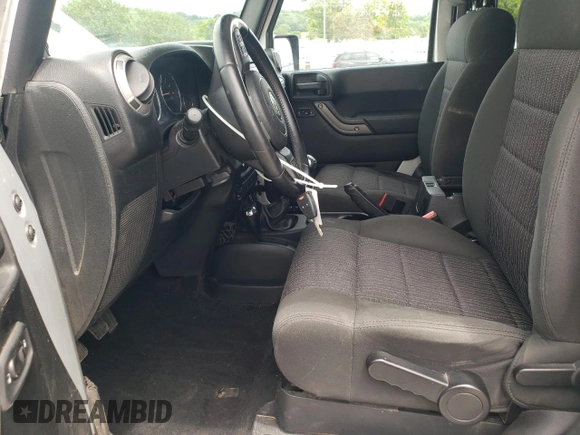 2012 Jeep Wrangler Sport z VIN 1C4AJWAG4CL185009, wystawiony jako Copart lot #61203395 z przebiegiem 93 534 mil mil oraz Szkoda całkowita • Salvage title. Historia ofert i sprzedaży dostępna na DreamBid. Obrazek 7.