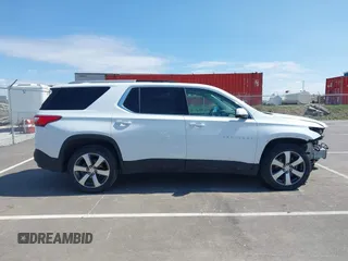 2018 Chevrolet Traverse LT z VIN 1GNEVHKW3JJ125861, wystawiony jako IAAI lot #41876184 z przebiegiem 95 223 mil mil oraz . Historia ofert i sprzedaży dostępna na DreamBid. Obrazek 13.
