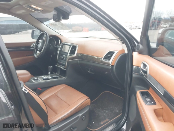 2012 Jeep Grand Cherokee Overland with VIN 1C4RJFCG3CC148601, listed as a IAAI auction lot 41717658 with 127,681 mi miles. Bid and sale history available at carsss.com. Image 5.