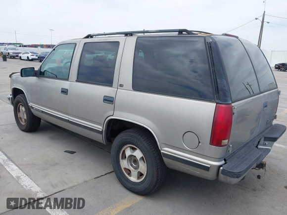 1999 Chevrolet Tahoe Z71 with VIN 1GNEK13R4XJ504675, listed as a IAAI auction lot 42162102 with 320,128 mi miles and . Bid and sale history available at DreamBid. Image 3.