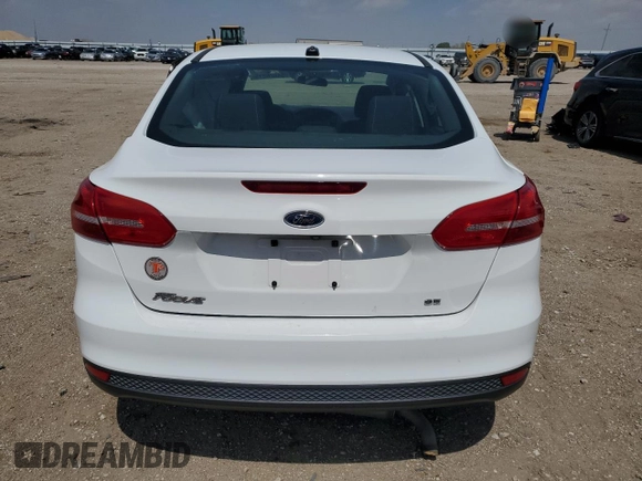 2018 Ford Focus SE z VIN 1FADP3F25JL272797, wystawiony jako Copart lot #54626215 z przebiegiem 116 679 mil mil oraz Szkoda całkowita • Salvage title. Historia ofert i sprzedaży dostępna na DreamBid. Obrazek 6.