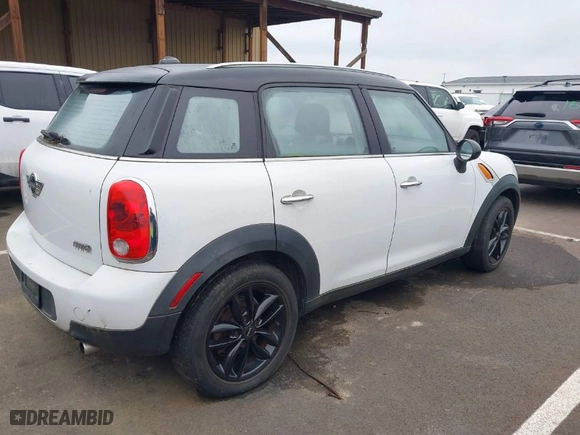 2011 MINI Cooper Countryman with VIN WMWZB3C54BWM01011, listed as a IAAI auction lot 41809669 with 1 mi miles. Bid and sale history available at carsss.com. Image 4.