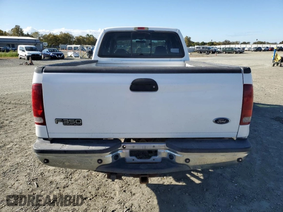 2003 Ford F-350 XL with VIN 1FTSW30F63EB07672, listed as a Copart auction lot 76659184 with 243,580 mi miles and Salvage Title. Bid and sale history available at DreamBid. Image 6.
