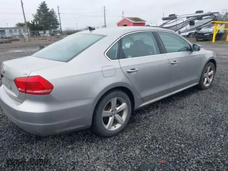 2014 Volkswagen Passat Wolfsburg Ed with VIN 1VWAT7A33EC060225, listed as a IAAI auction lot 41818949 with 163,545 mi miles. Bid and sale history available at carsss.com. Image 4.
