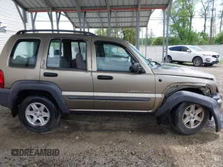 2003 Jeep Liberty Sport z VIN 1J4GK48K63W602709, wystawiony jako IAAI lot #42176496 z przebiegiem 151 397 mil mil oraz . Historia ofert i sprzedaży dostępna na DreamBid. Obrazek 13.