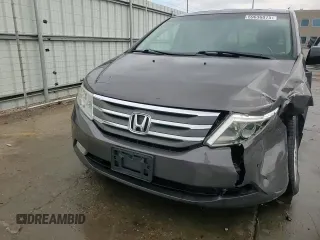 2012 Honda Odyssey Touring with VIN 5FNRL5H94CB109257, listed as a Copart auction lot 59636075 with 107,543 mi miles and Salvage title. Bid and sale history available at DreamBid. Image 14.