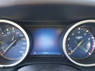 2014 Maserati Ghibli with VIN ZAM57XSA4E1090315, listed as a IAAI auction lot 41423507 with 115,323 mi miles. Bid and sale history available at carsss.com. Image 7.