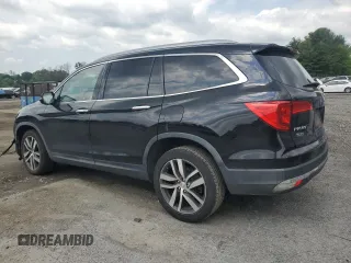 2017 Honda Pilot Touring with VIN 5FNYF6H90HB024321, listed as a Copart auction lot 57459895 with 134,244 mi miles and Salvage title. Bid and sale history available at DreamBid. Image 2.