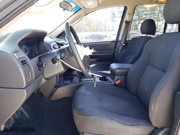 2003 Jeep Grand Cherokee Laredo with VIN 1J4GW48SX3C589100, listed as a Copart auction lot 49986745 with 247,687 mi miles and Salvage Title. Bid and sale history available at carsss.com. Image 7.
