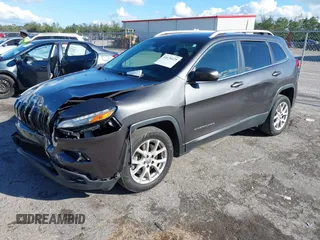 2016 Jeep Cherokee Altitude with VIN 1C4PJLCSXGW363598, listed as a IAAI auction lot 41670125 with 135,603 mi miles. Bid and sale history available at carsss.com. Image 17.