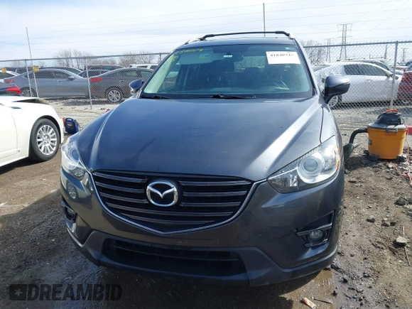 2016 Mazda CX-5 Touring with VIN JM3KE4CY9G0915305, listed as a IAAI auction lot 41840519 with 188,702 mi miles and . Bid and sale history available at carsss.com. Image 12.