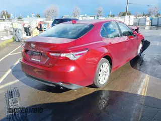 2020 Toyota Camry LE with VIN 4T1C11AK4LU916494, listed as a IAAI auction lot 41786429 with 100,032 mi miles and . Bid and sale history available at DreamBid. Image 4.