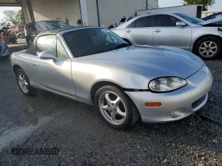 2002 Mazda MX-5 Miata Cloth with VIN JM1NB353420220801, listed as a Copart auction lot 61808645 with 116,451 mi miles and Salvage title. Bid and sale history available at DreamBid. Image 4.