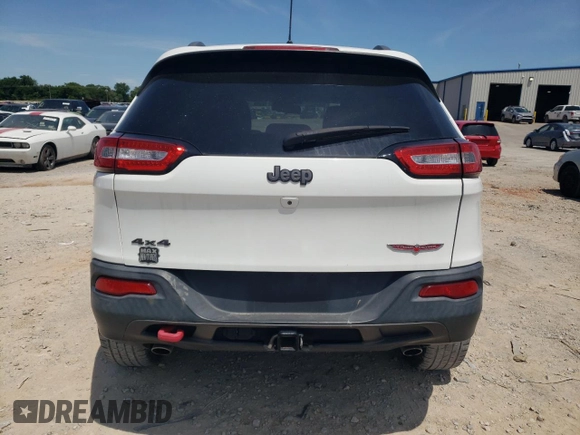 2016 Jeep Cherokee Trailhawk with VIN 1C4PJMBS3GW102000, listed as a Copart auction lot 60866505 with 120,985 mi miles and Salvage title. Bid and sale history available at DreamBid. Image 6.