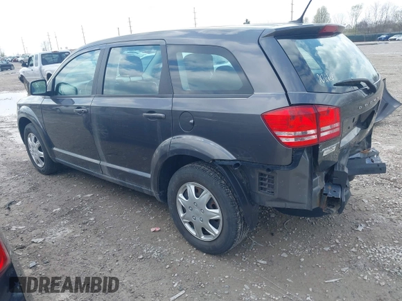 2014 Dodge Journey SE with VIN 3C4PDCAB1ET219760, listed as a IAAI auction lot 42013441 with 106,212 mi miles and . Bid and sale history available at carsss.com. Image 3.