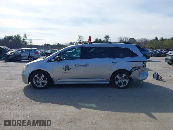 2012 Honda Odyssey Touring with VIN 5FNRL5H95CB063003, listed as a IAAI auction lot 41871975 with 179,332 mi miles and . Bid and sale history available at DreamBid. Image 14.
