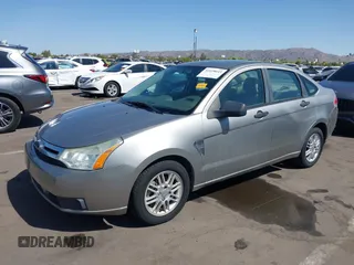 2008 Ford Focus SE with VIN 1FAHP35N68W154490, listed as a IAAI auction lot 42128643 with 141,316 mi miles. Bid and sale history available at carsss.com. Image 2.