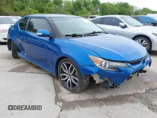 2014 Scion tC with VIN JTKJF5C77E3081277, listed as a IAAI auction lot 41932581 with 135,556 mi miles. Bid and sale history available at carsss.com. Image 1.