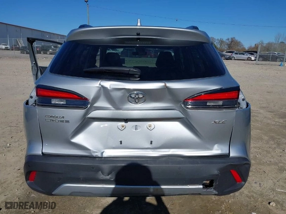 2022 Toyota Corolla Cross XLE with VIN 7MUDAAAG4NV004482, listed as a IAAI auction lot 41631653 with 64,746 mi miles. Bid and sale history available at carsss.com. Image 6.