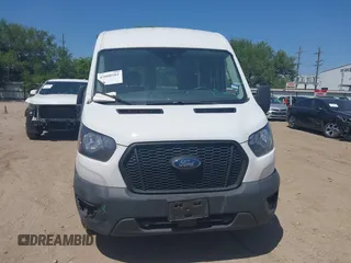 2021 Ford Transit Cargo with VIN 1FTBR1C8XMKA64837, listed as a IAAI auction lot 42008582 with 74,562 mi miles and . Bid and sale history available at DreamBid. Image 12.