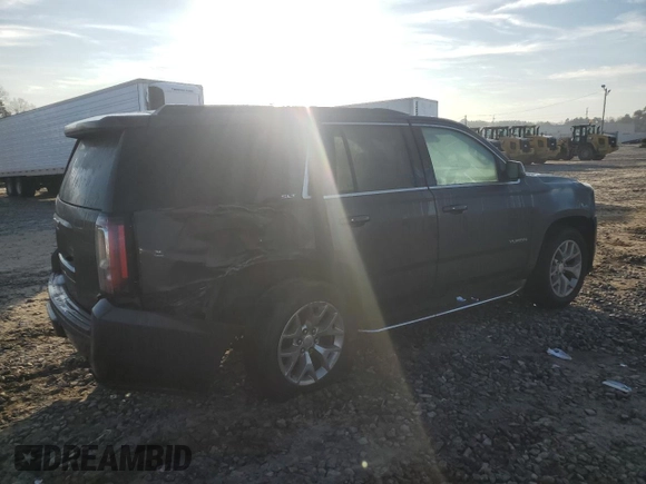 2015 GMC Yukon SLT with VIN 1GKS1BKC0FR735059, listed as a Copart auction lot 42960685 with 242,220 mi miles and Salvage Title. Bid and sale history available at carsss.com. Image 3.