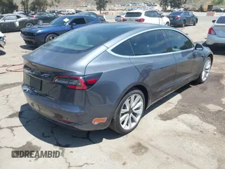 2020 Tesla Model 3 Standard Range Plus with VIN 5YJ3E1EAXLF615781, listed as a IAAI auction lot 42068935 with 96,026 mi miles. Bid and sale history available at carsss.com. Image 4.