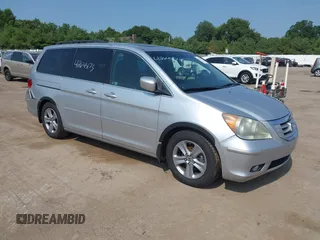 2010 Honda Odyssey Touring with VIN 5FNRL3H97AB013477, listed as a IAAI auction lot 42645173 with 118,876 mi miles and . Bid and sale history available at DreamBid. Image 1.