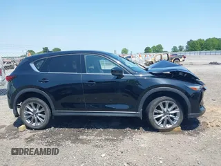 2020 Mazda CX-5 Grand Touring with VIN JM3KFADM9L1837183, listed as a IAAI auction lot 42340628 with 81,975 mi miles and . Bid and sale history available at DreamBid. Image 13.