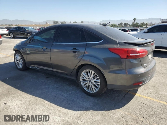 2017 Ford Focus Titanium with VIN 1FADP3J22HL279854, listed as a Copart auction lot 61209135 with 106,323 mi miles and Salvage title. Bid and sale history available at DreamBid. Image 2.
