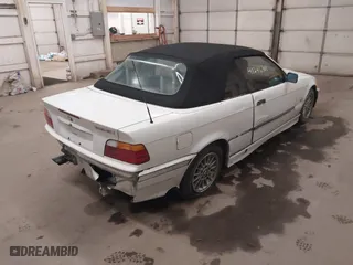 1997 BMW 3-Series 328IC with VIN WBABK832XVET95942, listed as a IAAI auction lot 41246303 with 165,825 mi miles. Bid and sale history available at carsss.com. Image 4.